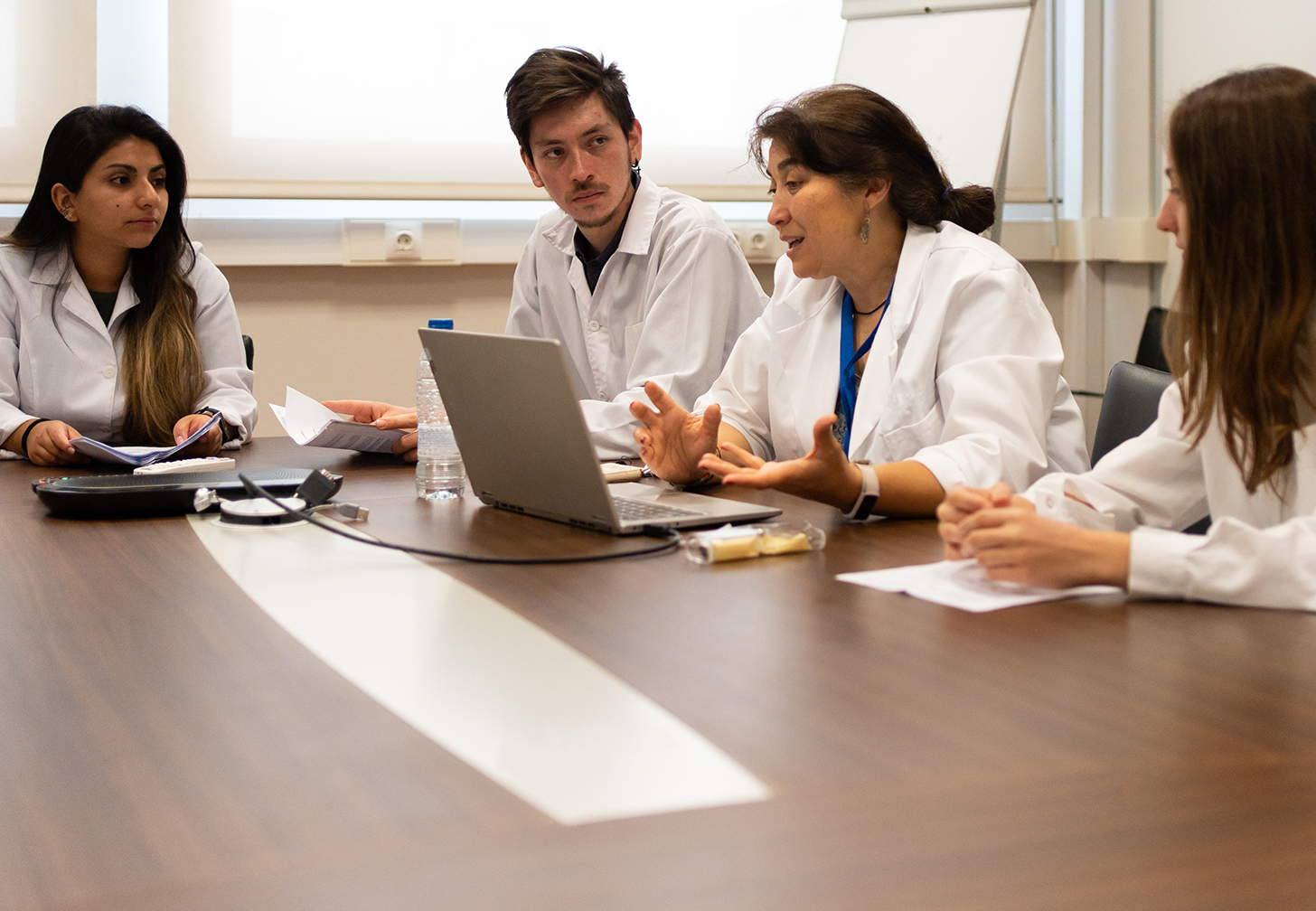 Four scientists sitting at a table.